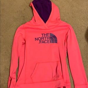 A Orange-ish pink north face sweatshirt